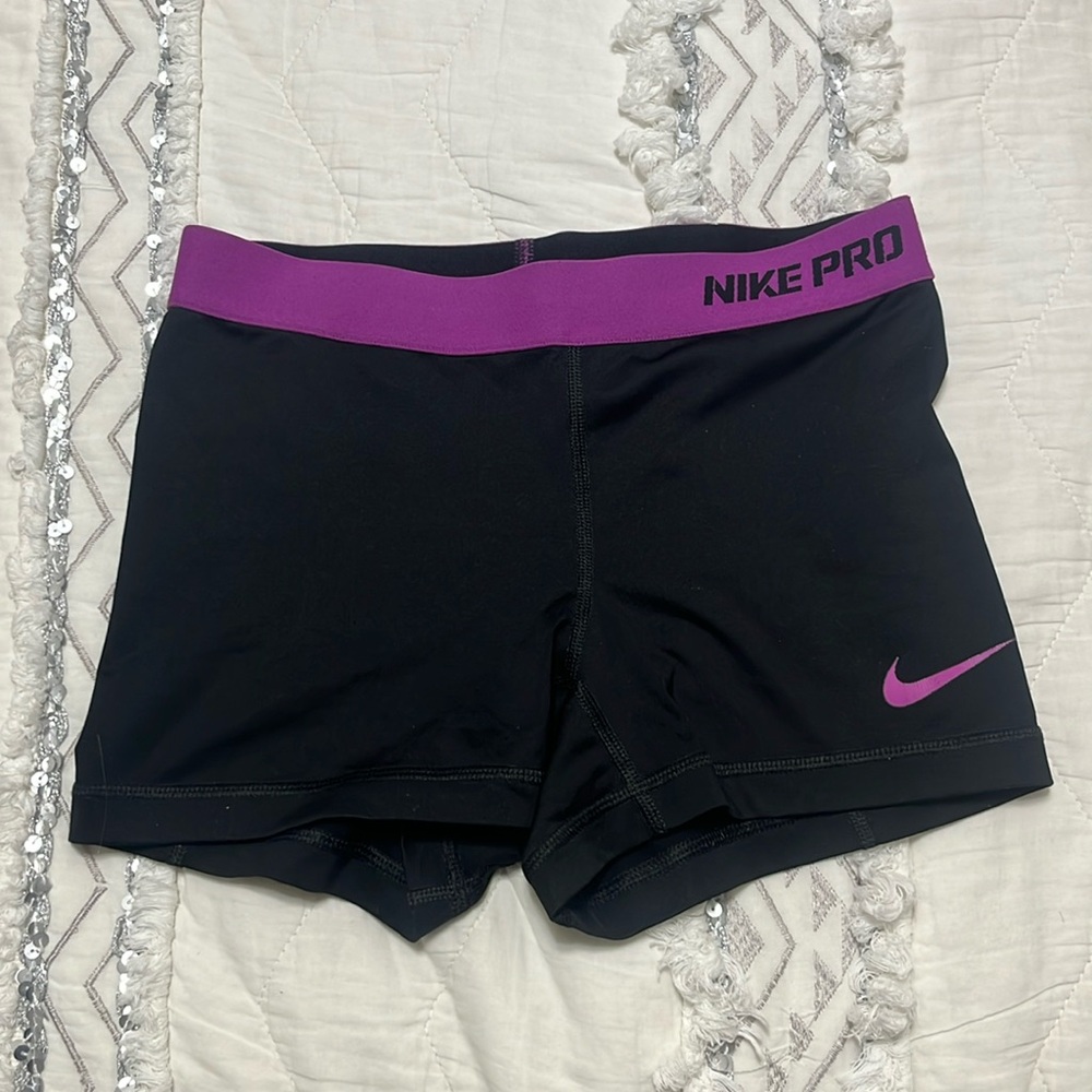 black nike pros with purple waist band
